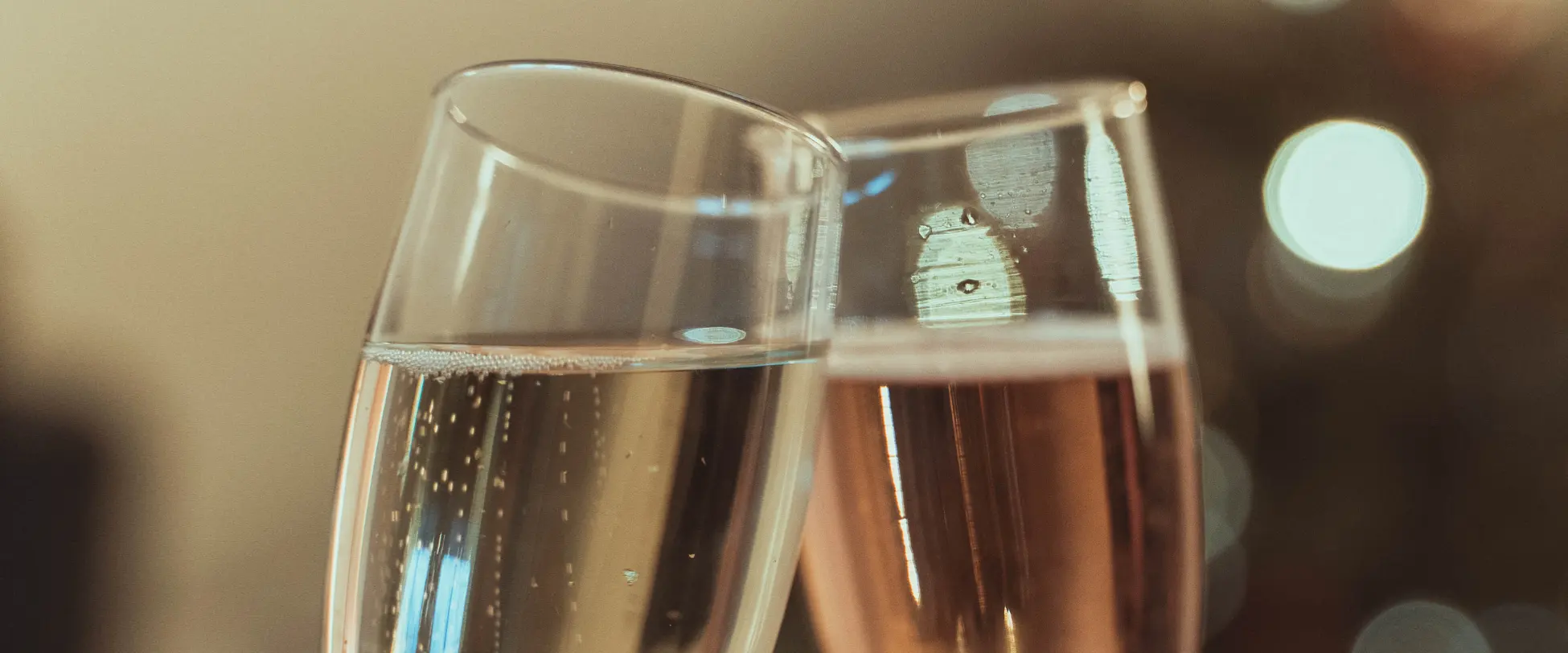 Two glasses of fizz clinking..